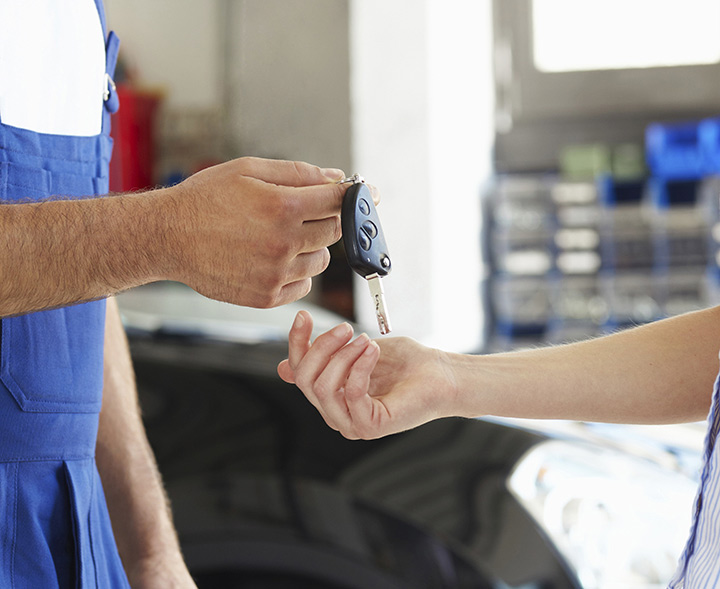 mechanic handing over the keys